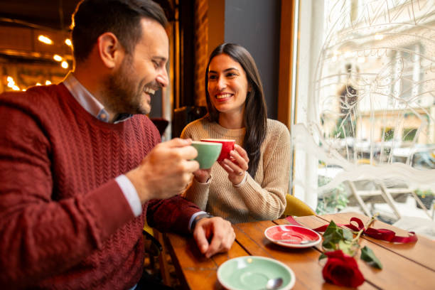 istock Couple Enjoying Valentines Day at Cozy Cafe 2190658359