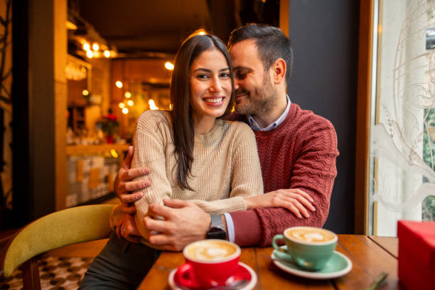istock Smiling Caucasian Couple Enjoying Romantic Cafe Date 2190658380