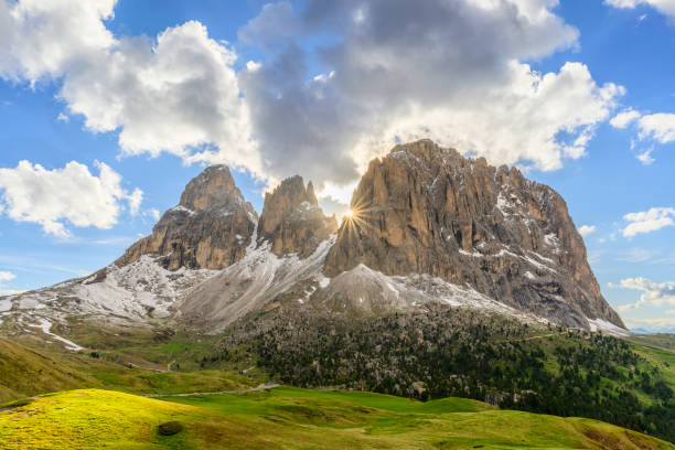 The impressive Langkofel or Sassolungo mountain in the Italian Dolomites with the setting sun in the background. The Langkofel (also known as Sassolungo in Italian) is a prominent mountain in the Dolomites, a mountain range in northern Italy. It is part of the South Tyrol region and is one of the most recognizable peaks in the area. The Langkofel massif is composed of several summits, with the highest peak, the Langkofel Spitze, reaching an elevation of 3,181 meters (10,436 feet).