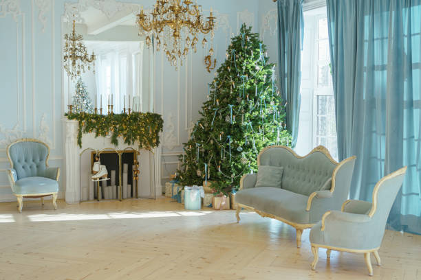 istock Beautifully decorated Christmas tree with gift boxes and vintage couch in elegant room 2190659177