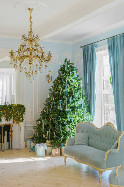 istock Beautifully decorated Christmas tree with gift boxes and vintage couch in elegant room 2190659188
