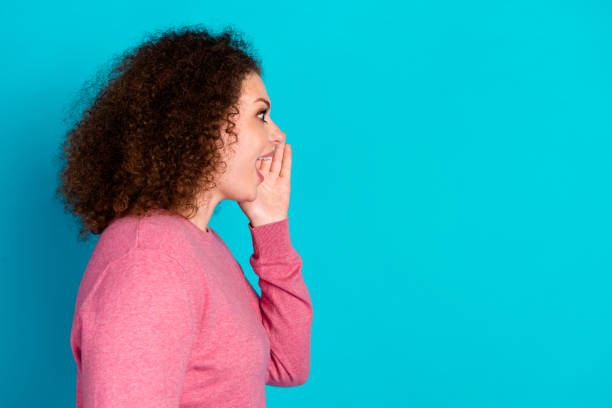istock Profile photo of pretty young woman communicate empty space wear pink pullover isolated on teal color background 2190660224