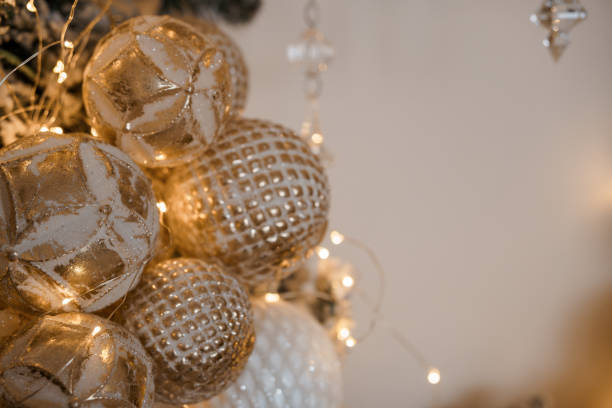 istock Glamorous Gold and White Christmas Ornaments with Twinkling Lights 2190661121