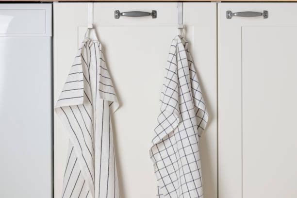 istock A minimalistic white kitchen cabinet beneath the sink holds a dish rag or towels, blending style with functionality and keeping essentials within easy reach 2190663325