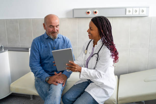istock Doctor and patient going over test results using digital tablet at doctor's office 2190665447