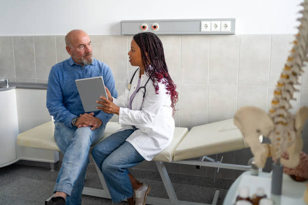 istock Doctor and patient going over test results using digital tablet at doctor's office 2190665449