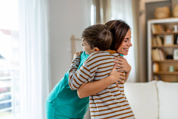 istock Loving mother hugging smiling child, radiating happiness and affection while relaxing in bright, comfortable living space 2190666379