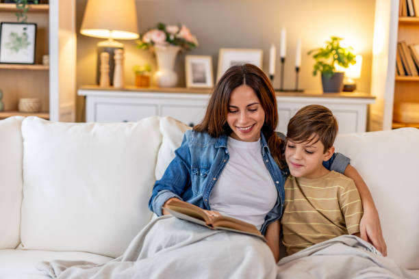 istock Parent reading storybook with child, sharing intimate bonding experience at home 2190666541