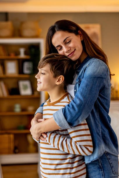 istock Mother and son sharing a tender moment while looking out the window at home, enjoying each other's company and the view 2190666666