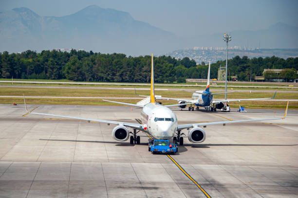 istock Two passenger planes waiting at the airport 2190667782
