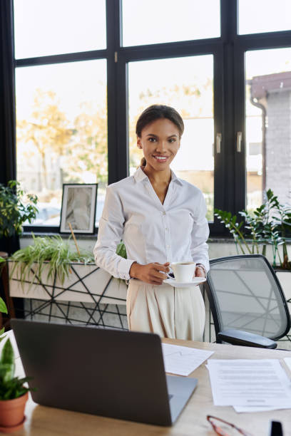 istock Young african american businesswoman working confidently in a modern office setting 2190667847