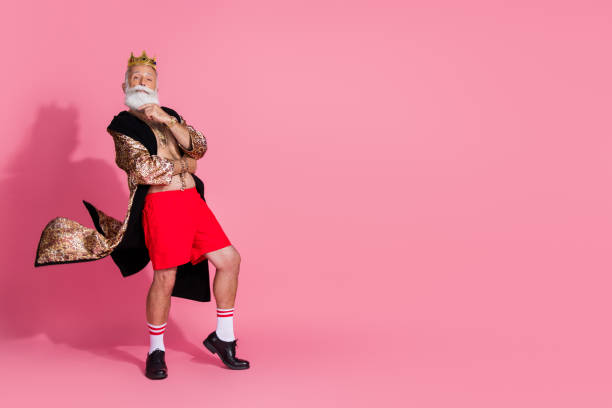 istock Full body portrait of funky extravagant man leopard bathrobe crown empty space ad isolated on pink color background 2190670171
