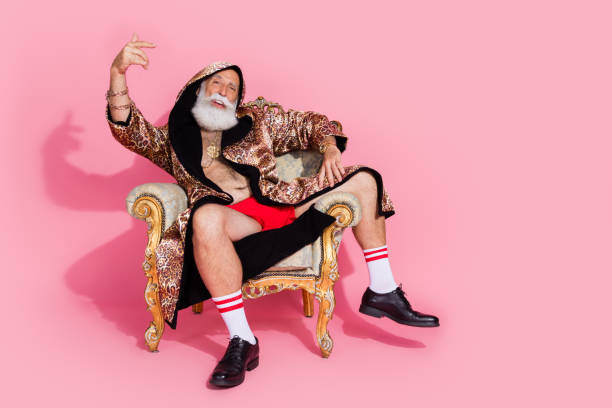 istock Full body portrait of millionaire boastful man sit throne leopard bathrobe empty space isolated on pink color background 2190670208