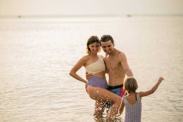istock Happy family holidays on the beach. 2190672914