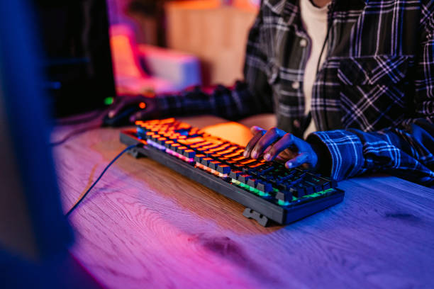 istock Young Black Woman Playing A Video Game On Her Desktop PC 2190674352