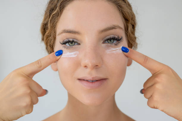 istock Female apply cream on under eye 2190678006