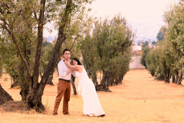 istock Couple in a field of olive trees 2190678227
