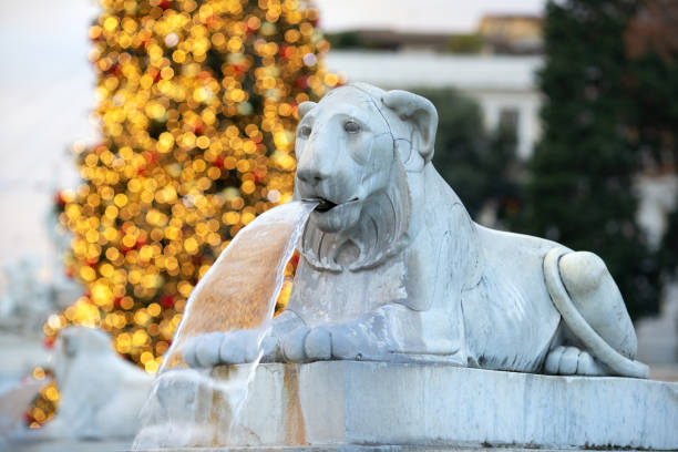 Rome, Italy - December 18, 2024: Fountain of the Lions made 1823 by Valadier and Christmas tree, Piazza del Popolo.