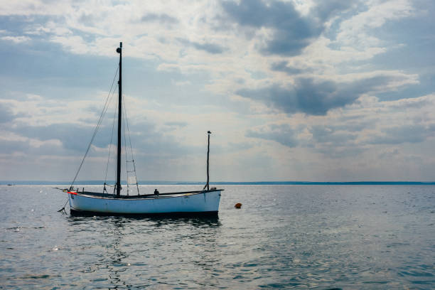 istock Small Ship Sailing in Sea at Sunny Day 2190684336