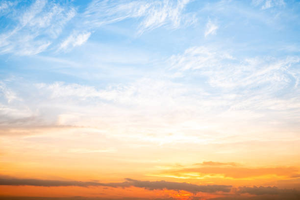 istock Sky,sunset, beautiful , luxury soft gradient orange gold clouds and sunlight on the blue sky perfect for the background, Sunrise on morning or everning in winter warm time ,Twilight summer,silhouette 2190684595