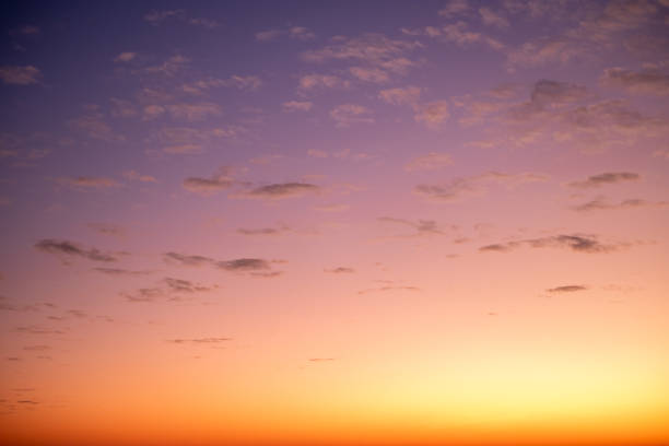 Colorful of sunset sky and clouds sunset background. Real amazing sunrise or sunset sky with gentle colorful clouds.