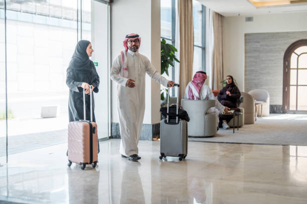 istock Smiling Arabic Couple Arriving at Luxury Hotel 2190686960