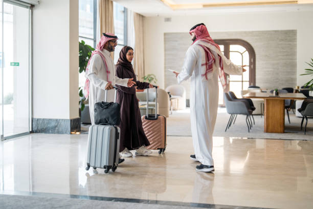 istock Smiling Arabic Hotel Manager Welcomes Diverse Couple 2190686979