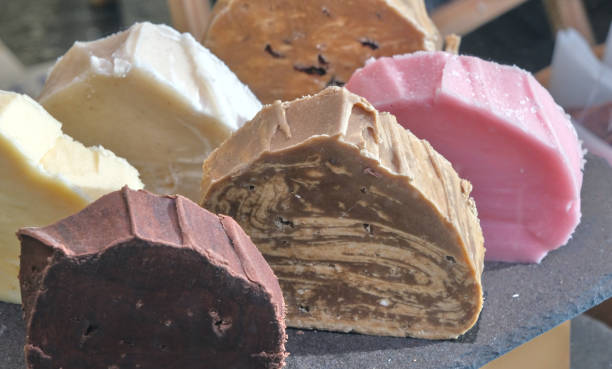 Assorted pieces of fudge in vibrant colors and marbled textures.