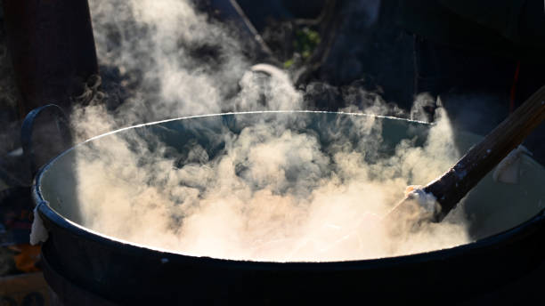 sancocho pot, Colombian traditions prepared on outdoor milk stove prepared by female hands