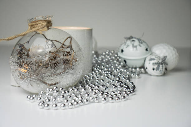 New Year decorations and candles on a white background. Christmas decorations close-up. Postcard, background for postcard, copy space
