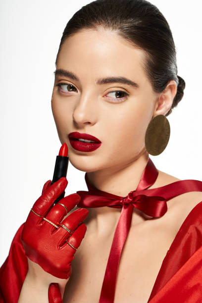 istock Fashion model showcasing bold makeup in a creative studio environment 2190694144