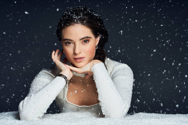 istock Captivating young woman embraces winter magic in studio elegance 2190694402