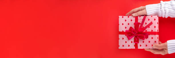istock Valentine day greeting card background with chocolates hearts and gift boxes 2190695577