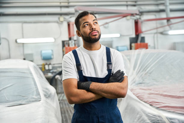 istock Experienced mechanic deep in thought at an auto repair service center 2190696130