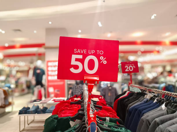 istock selective focus to red discount board with 50% writing. for discount templates for women's and men's clothing at the mall. soft focus 2190696268