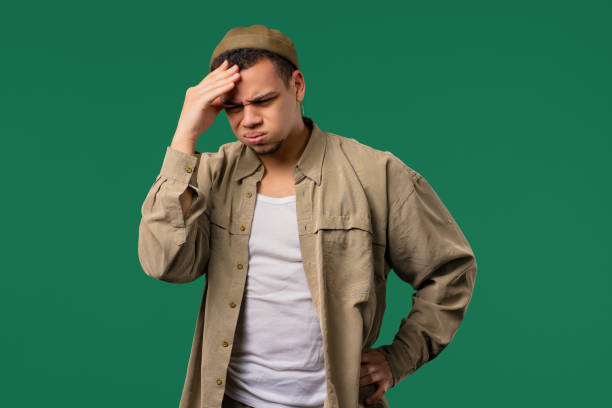 istock Young man having headache,studio portrait. Migraine,hypertension,magnetic storms 2190696794