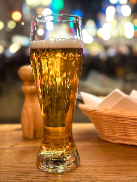 istock Pint of beer on table in traditional British pub 2190697651