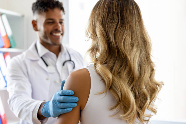 istock Doctor touching a patient's shoulder and smiling 2190697690