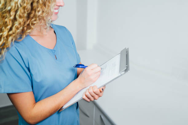 Woman filling a patient form