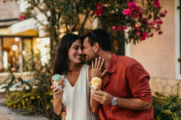 istock Couple eating ice cream cones 2190701499