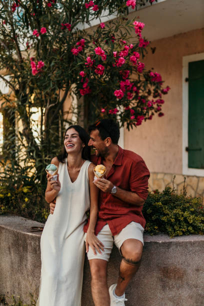 istock Couple eating ice cream cones 2190701710