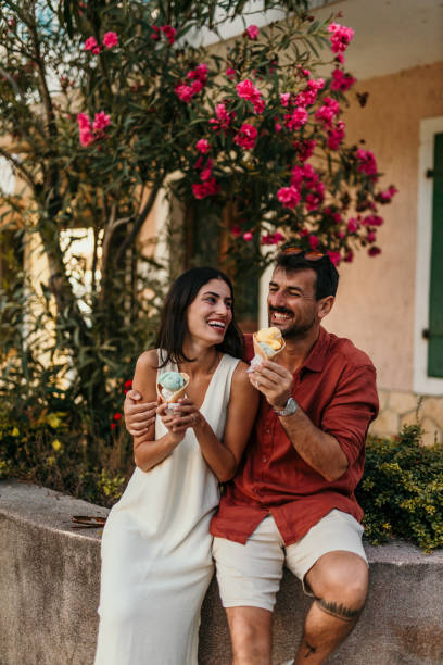 istock Couple eating ice cream cones 2190702297