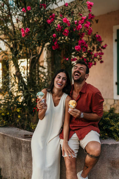 istock Couple eating ice cream cones 2190702301