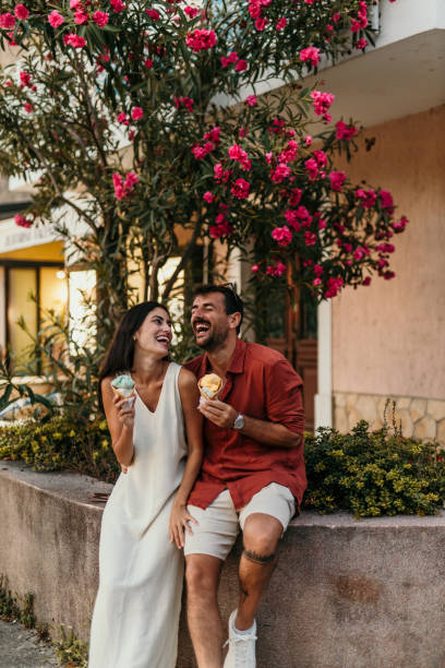istock Couple eating ice cream cones 2190702303