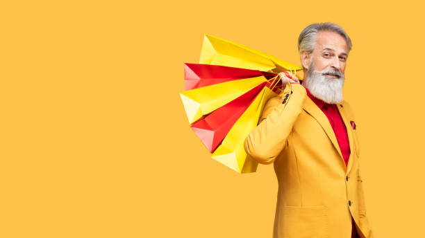 istock Stylish Elderly Man Posing in Yellow Outfit 2190702552