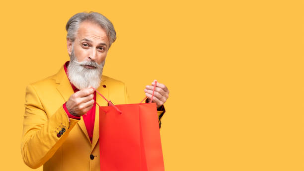 istock Stylish Elderly Man Posing in Yellow Outfit 2190702555