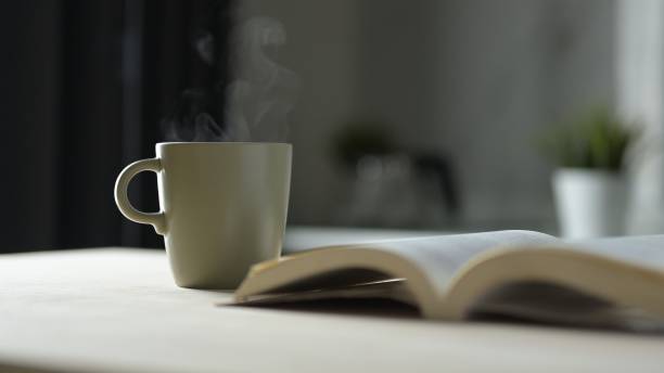 istock Cozy Room Still Life Sipping Coffee and Reading a Book in a Tranquil Environment for Relaxation and Reflection 2190705605