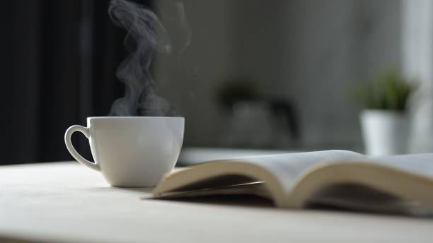 istock Enjoying Coffee and Reading at Home Cozy Environment Lifestyle Content Indoor Space Relaxed Viewpoint Serenity and Comfort 2190705612