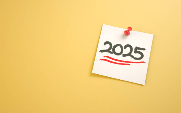 istock 2025 New Year Text Written on Note Paper Sitting on Yellow Background 2190706113