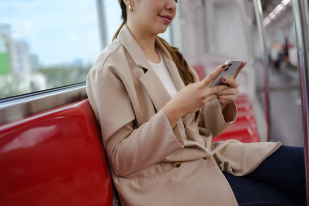 istock Young businesswoman is using her smartphone while commuting on a subway train, taking advantage of her travel time to stay connected and productive 2190706116